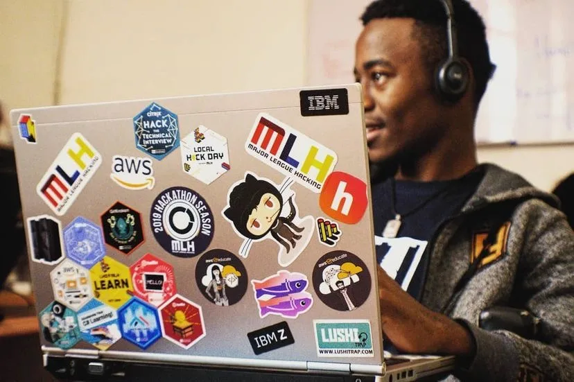 Bernard working with a laptop in a production context